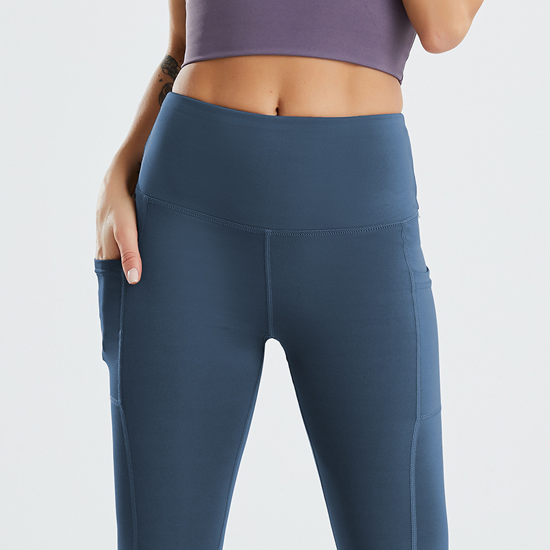 Amazon tamaño europeo pantalones de yoga transfronterizos bolsillo lateral de las mujeres melocotón cintura alta Levantamiento de cadera medias de fitness europeas y americanas