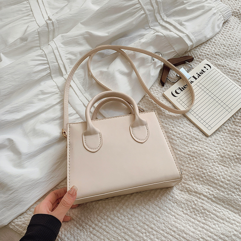 Bolso de mensajero femenino con textura de línea de moda 2025 nuevo bolso femenino portátil de moda de todo fósforo bolso cuadrado pequeño de gran capacidad de cercanías