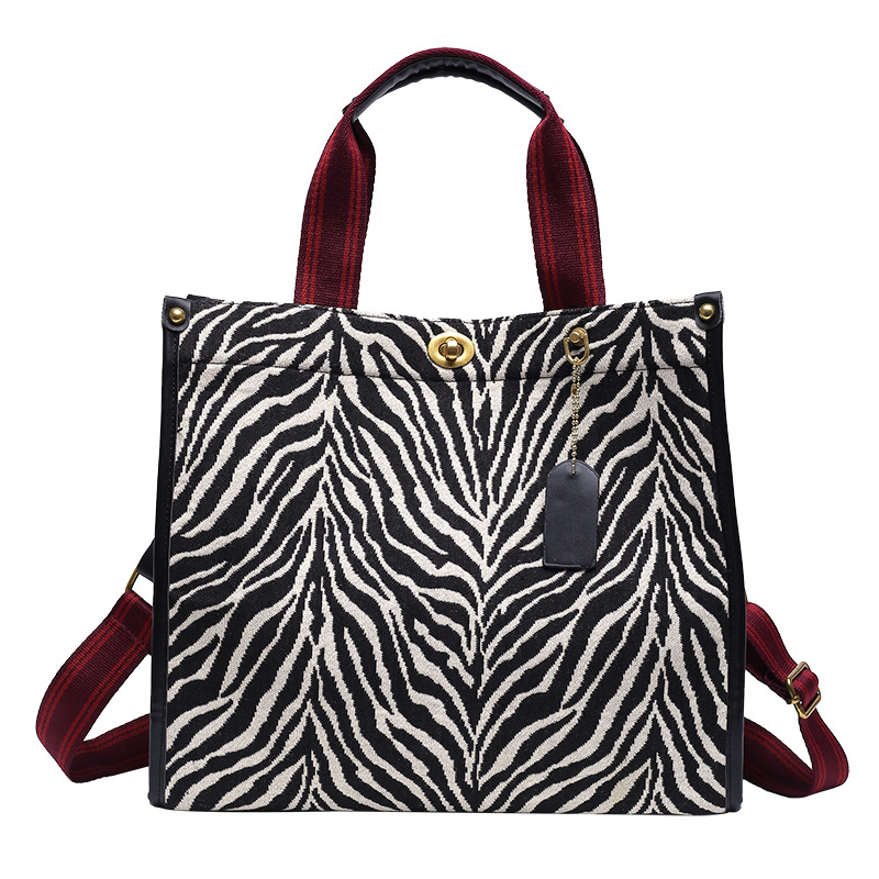 Bolso con estampado de leopardo para mujer 2024, nuevo bolso tote retro de moda para ir al trabajo, con hebilla texturizada, bolso bandolera de un solo hombro.