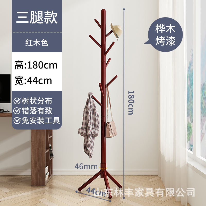 木の服のハンガーが床に落ちています。|undefined