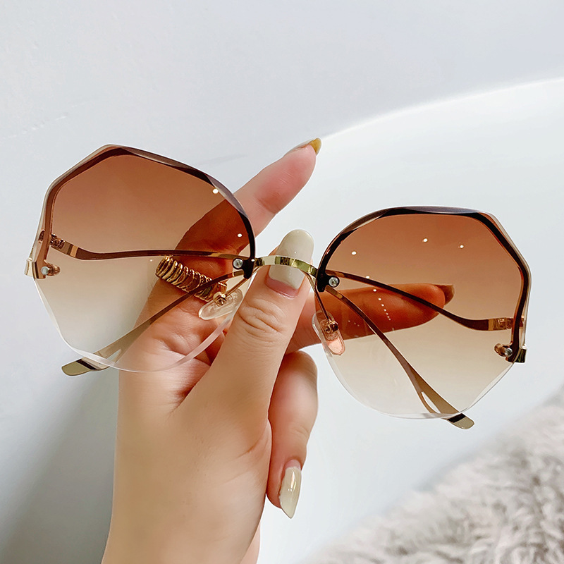 2024 Fashion Large Frame High-end Look Face Slimming UV Protection Rimless Cut Edge Sunglasses For Women_voghion.com
