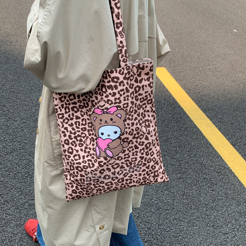 Bolsa de moda de balde, bolso de lona universal, mujer, otoño y invierno 2025, nuevo modelo de bolso de hombro con patrón de leopardo, bolso de brazo de viaje