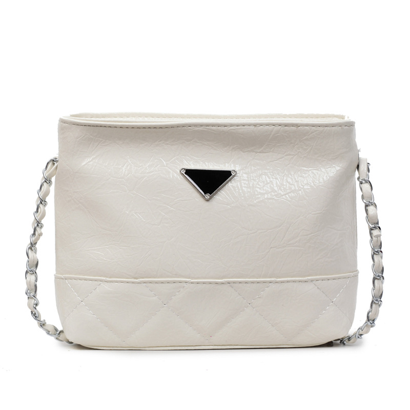 Bolsa de cadena de textura de alta calidad 2025 verano nuevo estilo bolso femenino moda patrón de agarre de mano bolso bandolera bordado con rombos