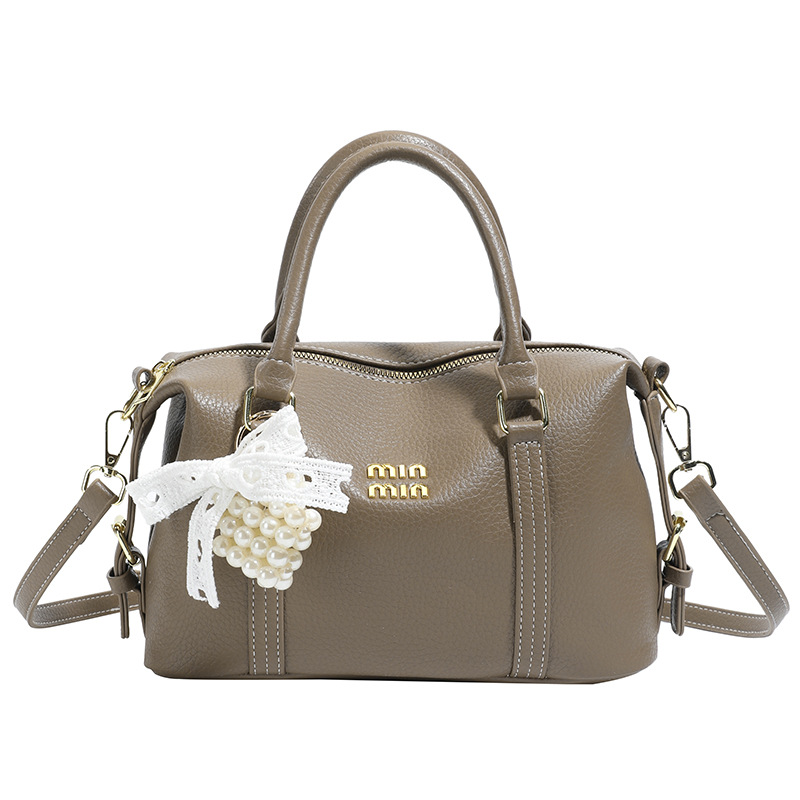 2026 nuevo bolso de bolos de mano de mujer simple sensación cotidiana de nicho de viaje coreano bolso de mujer bolso de almohada