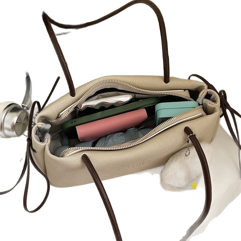 Nicho francés de viaje bolso de hombro bajo la axila para mujeres 2025 nuevo bolso de mano de alto nivel retro versátil bolso de palo