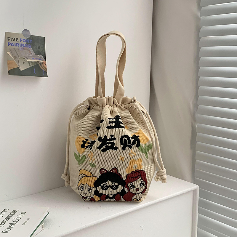 Bolsa de cinturón versátil nuevo patrón de dibujos animados nicho lindo bolso de arroz de almuerzo de cuerda bolso de cubo de mano bolso de brazo