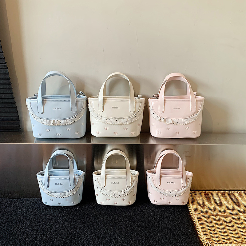 Amor extranjero en relieve, bolsas de cestas para niños y niñas, bolsas de mano de encaje dulce coreana, nuevas bolsas de niños transfronterizas