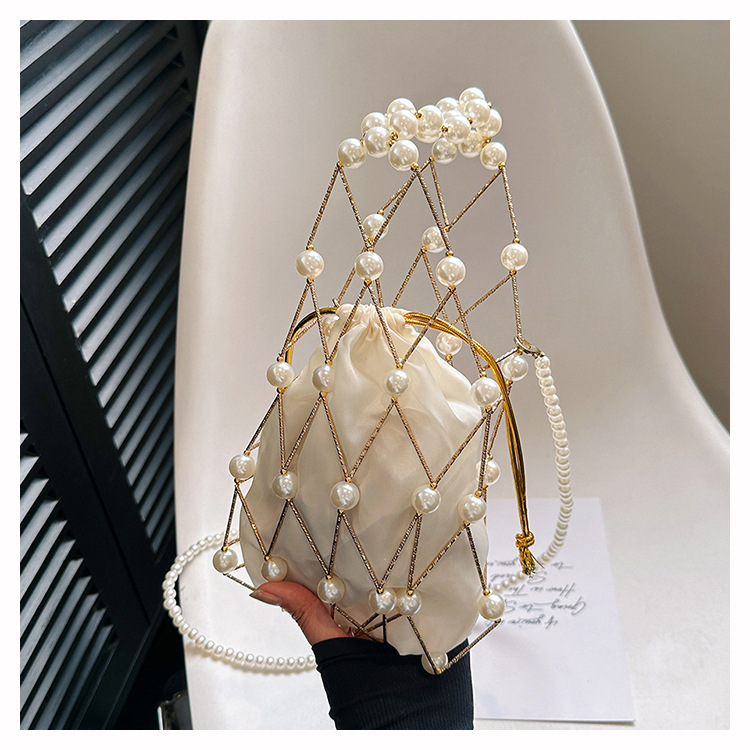 Women's Small Plastic Solid Color Vacation Beach Pearls Hollow String Beach Bag display picture 1