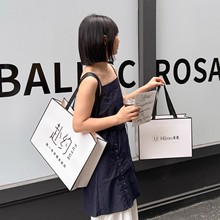 高级服装店手提袋子购物纸袋女装包装衣服礼饰品美容院免费印logo