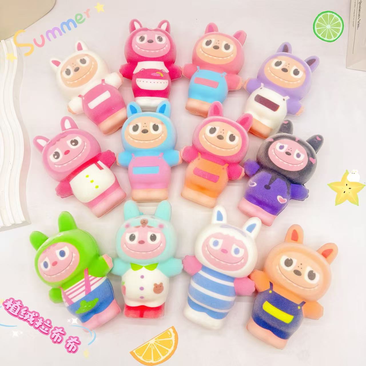 Labubu rabu flocado pellizcar música para descomprimir nuevos juguetes transfronterizos caja ciega colgante de muñeca macaron de tercera generación
