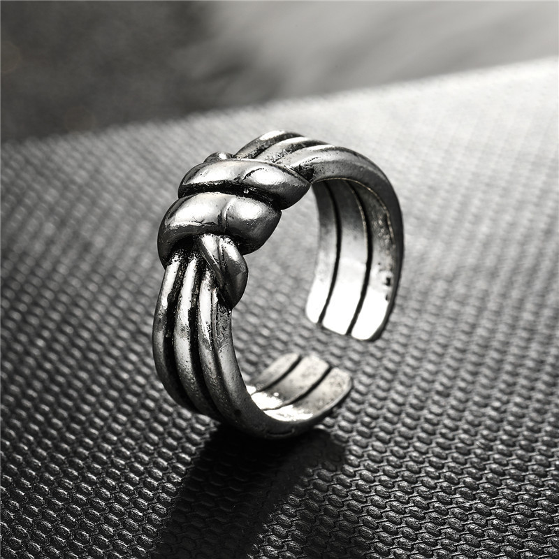 Fashion Geometric Bow Smooth Hollow Metal Ring display picture 1