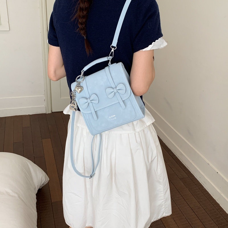 Mochila de temperamento de viaje femenino 2026 de alto valor de cara simple coreana mochila de viaje nuevo arco bolso pequeño