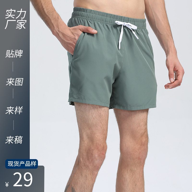 Pantalones cortos de tres puntos de secado rápido para deportes estadounidenses transfronterizos, nuevos pantalones de entrenamiento de fútbol para correr sueltos y transpirables para maratón masculino