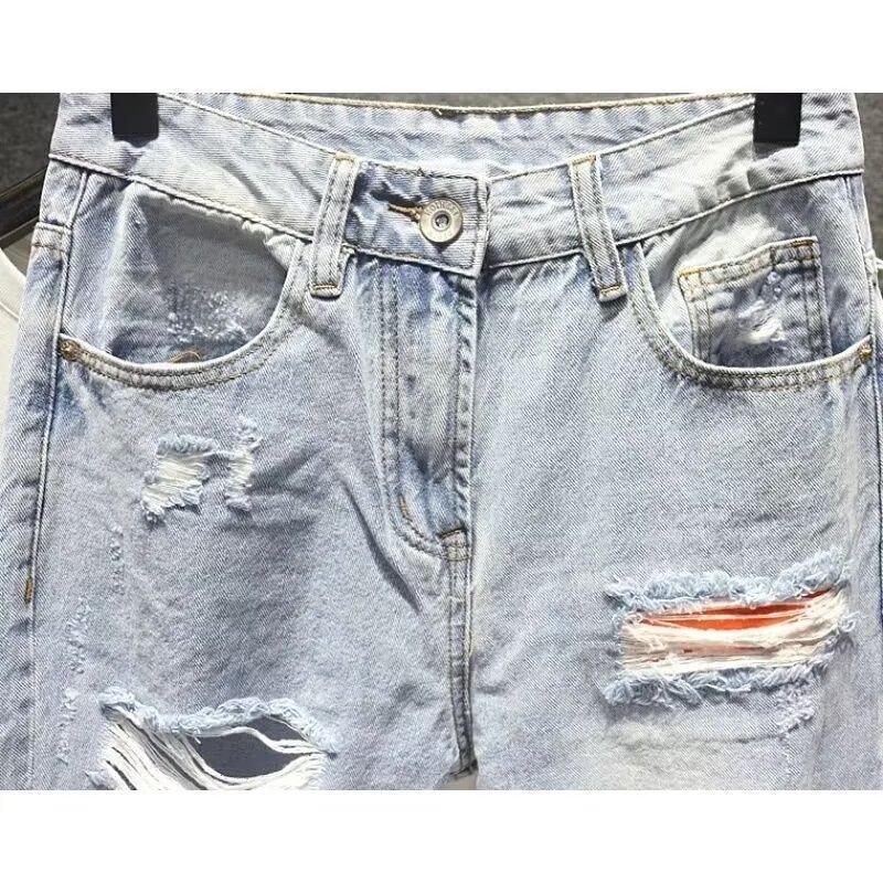 Męskie jeansy vintage z przetarciami o prostym i luźnym kroju_voghion.com