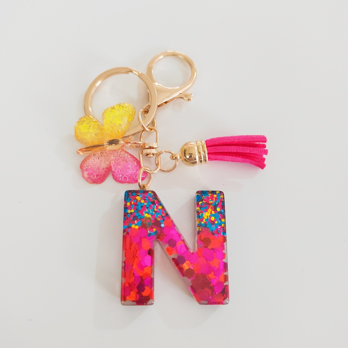 Ventas transfronterizas calientes de letras inglesas de color mixto colgante de llavero colgante de mariposa fringe de resina de llavero colgante de joyería
