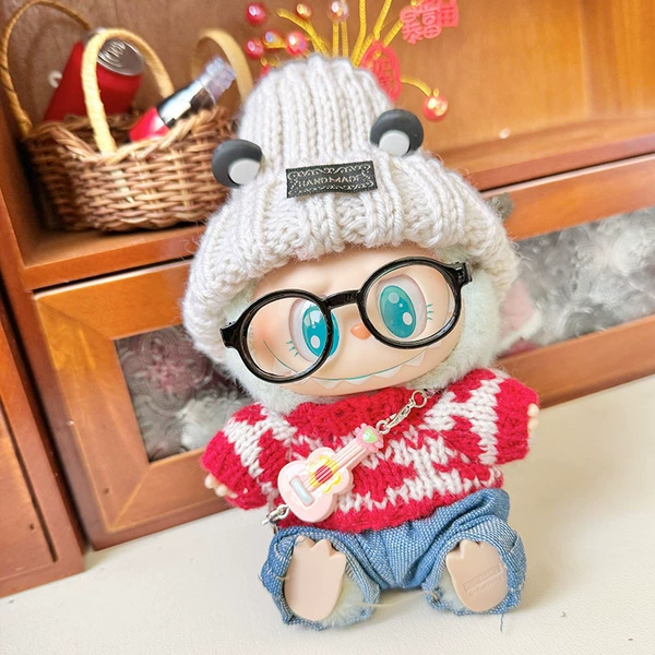 Grizzly ear hat + a row of red love + black framed glasses + blue jeans + small guitar