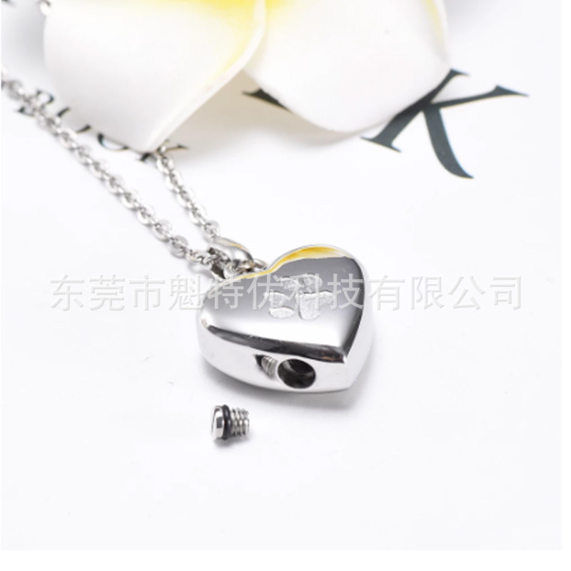 Japonés y coreano nuevo collar de acero de titanio de las mujeres no se desvanece en forma de corazón pata de impresión conmemorativa gato y perro mascota cinerario ataúd colgante impermeable