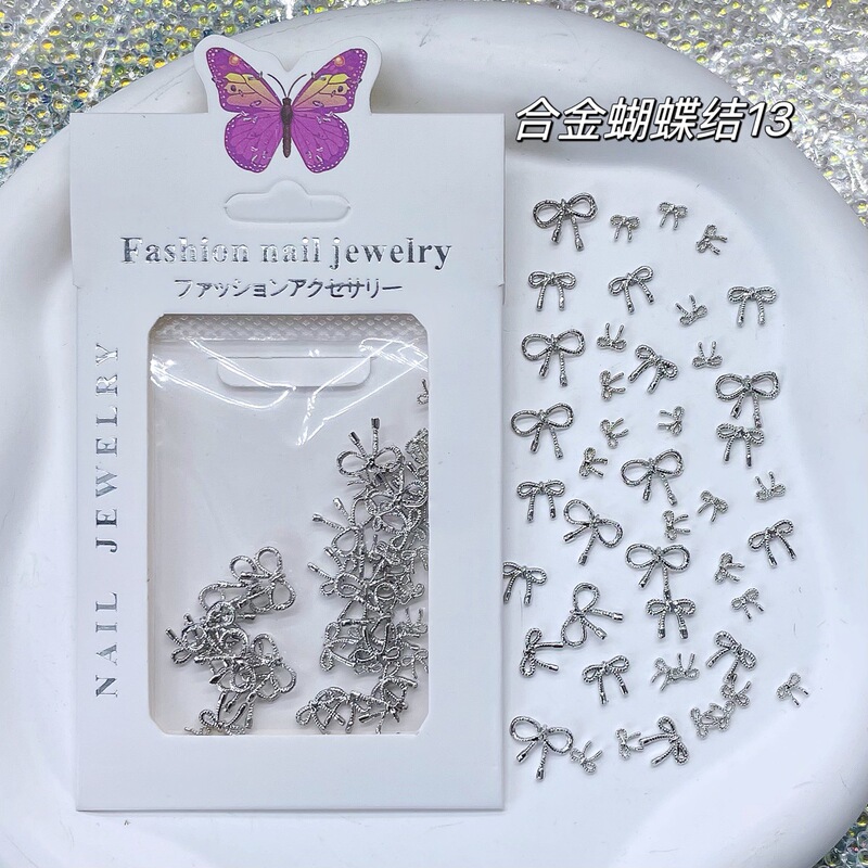 Cross-border nail art alloy trinkets metal bow nail accessories hollow alloy mini ribbon knot silver Cross-border nail art alloy trinkets metal bow nail accessories hollow alloy mini ribbon knot silver