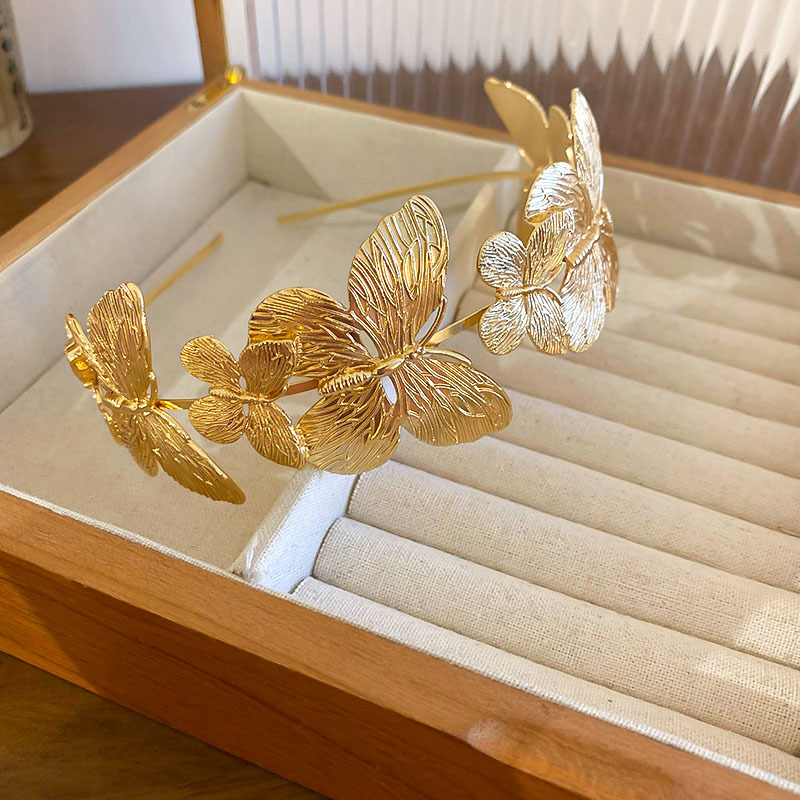 Diadema de metal de mariposa, diadema de presión superior de alta cabeza simple de moda, sentido de alta calidad, personalidad, todo fósforo, nuevos accesorios para el cabello al por mayor