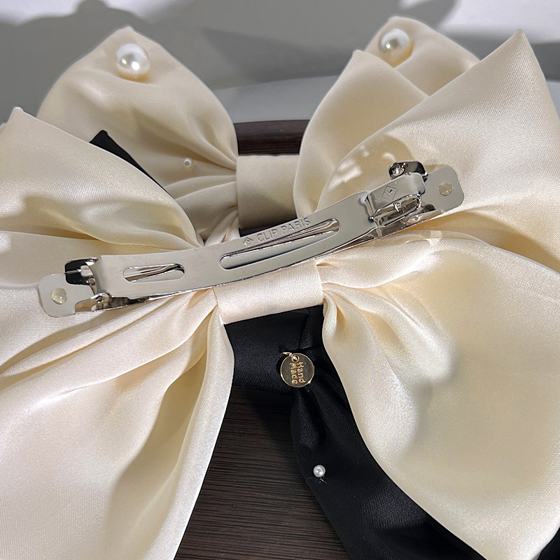 Fashion Solid Color Bowknot Shape Imitation Pearl  Fabric Hair Clip display picture 4