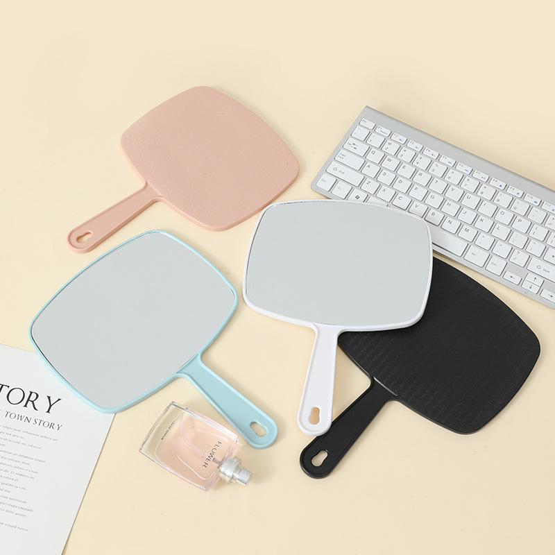 Espejo de maquillaje portátil de gran tamaño multifuncional colgante color sólido HD belleza mango espejo fábrica al por mayor