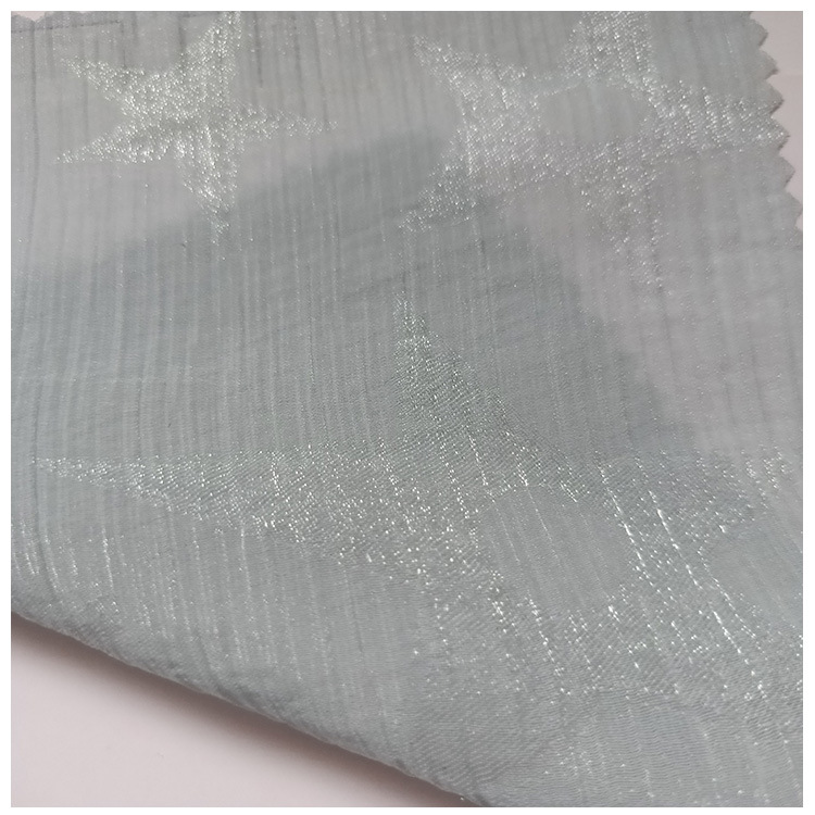 春夏女装童装裤裙休闲服面料饰锦涤混纺半透星星图案轧花现货供应