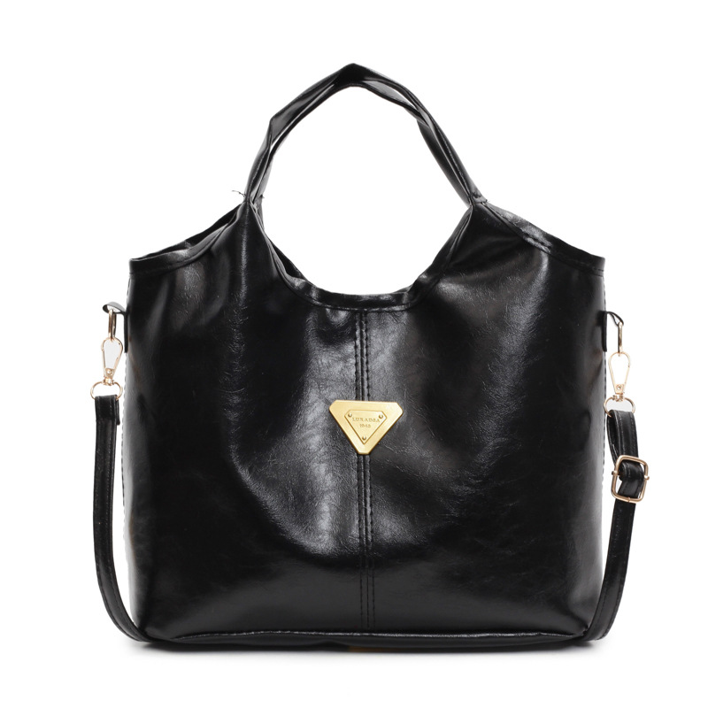 Tide retro nicho bolso de mano mujer 2025 primavera nueva piel de cera de aceite de transporte de gran capacidad bolso de hombro mochila