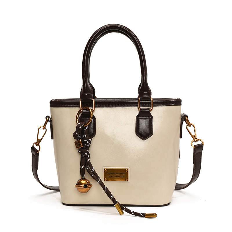 Retro versátil simple bolso de cubo portátil 2025 nuevo bolso de mujer nicho manuscrito de moda coreana bolso de hombro