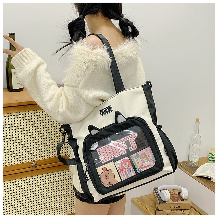 The new cute cartoon printed student bag with a large capacity and transparent student storage single-shoulder bag is selling well for women undefined