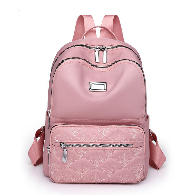 2024 nueva mochila de nailon casual para mujer simple y versátil mochila de viaje ligera al aire libre mochila escolar al por mayor