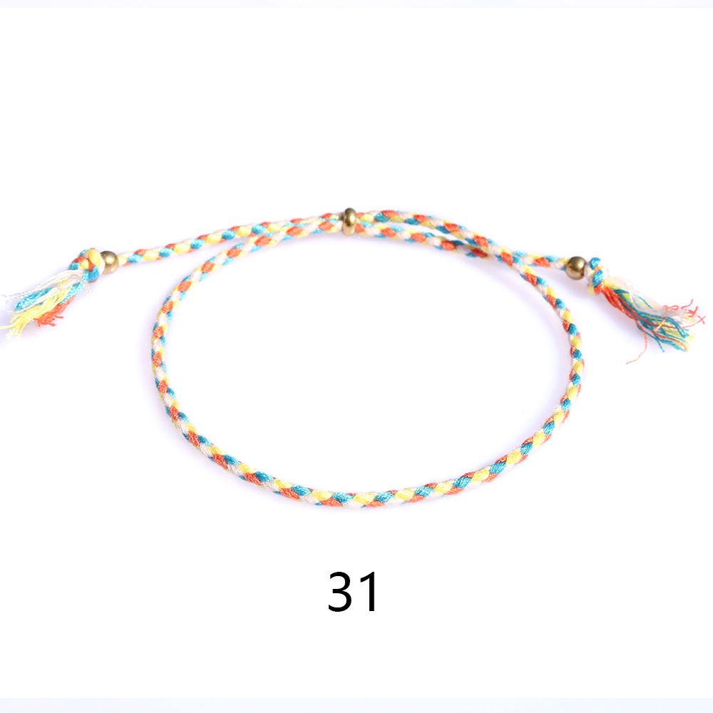 Amazon popular colorido cuerda de algodón amistad pulsera perlas de cobre borla pulsera tejida a mano ajustable hombres y mujeres pulsera