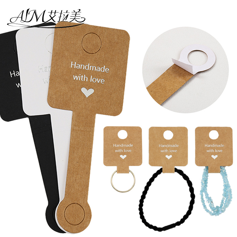 Tarjeta de embalaje adhesiva transfronteriza anillo de pelo joyería plegable Tarjeta de exhibición de cartón Tarjeta de pulsera de anillo de pelo al por mayor