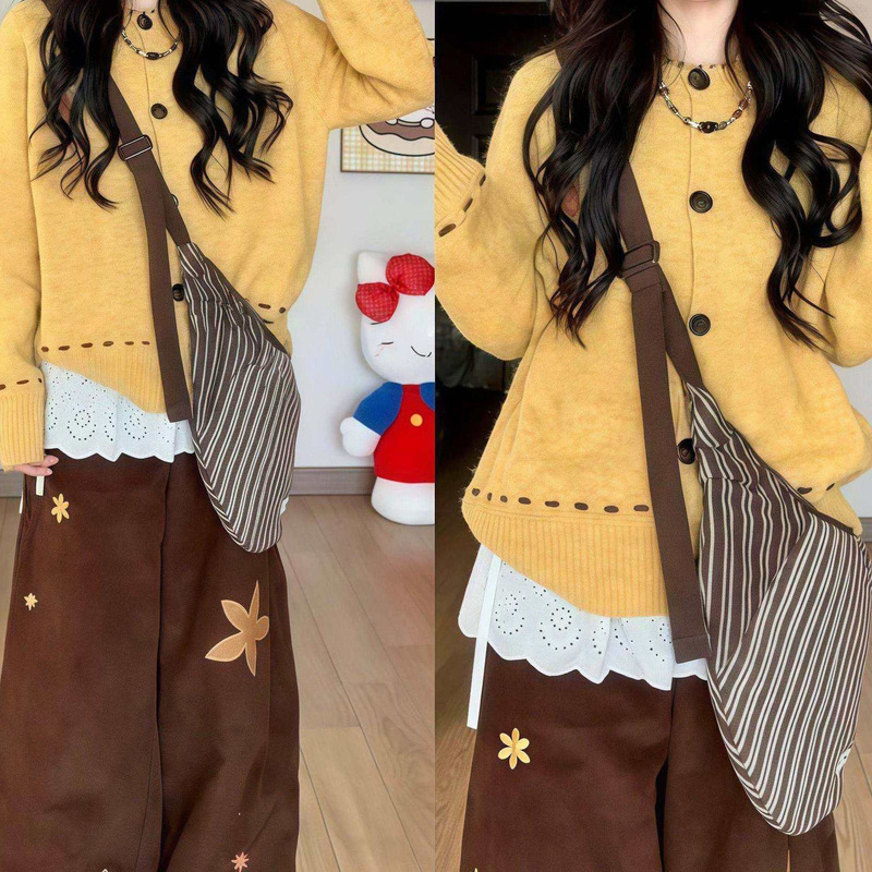 Autumnal yellow knitted cardigan for women, featuring a unique design with visible stitching, a loose fit, a slimming effect, and a gentle, elegant style, with long sleeves