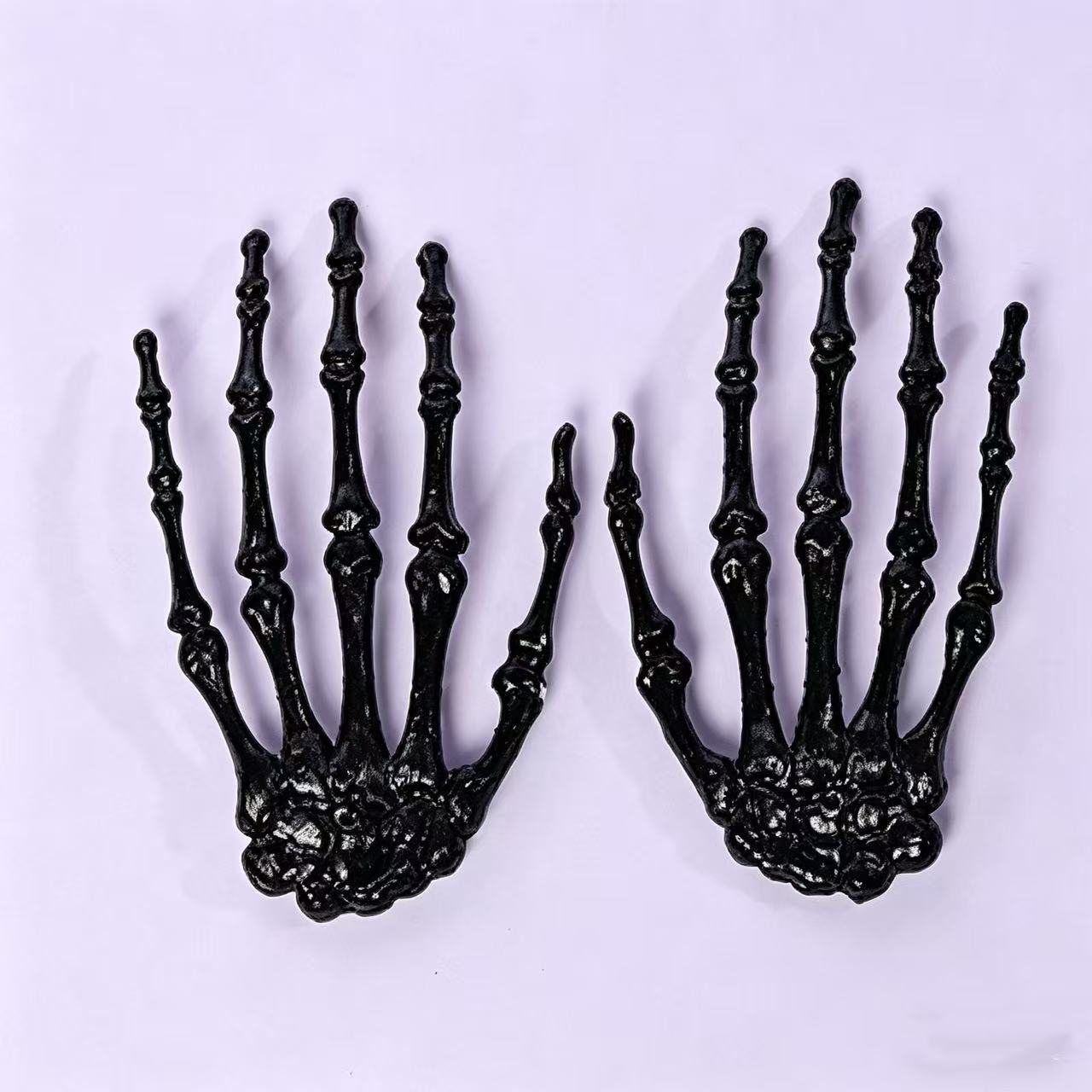 Accesorios de Halloween esqueleto transfronterizo hueso de mano de plástico colorido hueso de mano fantasma accesorios de decoración fuente directa