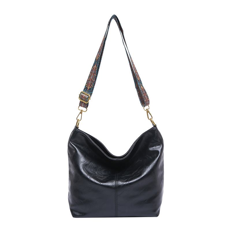 Bolso coreano de gran capacidad para mujeres 2024 otoño y invierno nuevo retro banda ancha mochila de hombro texturizada bolso de cubo de viaje