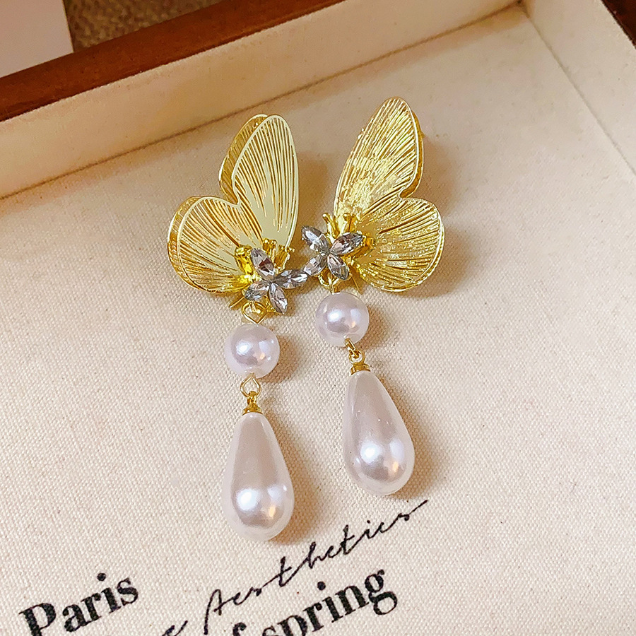 Aguja de plata MEDIADOS DE-antigua flor redonda borla pendientes de metal retro europeo y americano elegante luz pendientes de lujo al por mayor para las mujeres