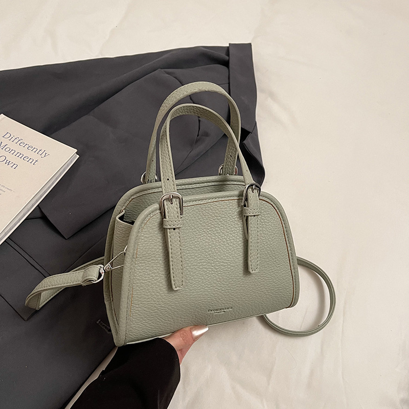 Bolsos populares de este año 2025 primavera y verano nuevo bolso femenino casual con patrón de lichi bolso de hombro simple bolso de mensajero de viaje