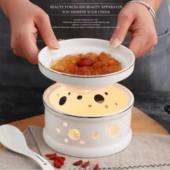ろうそくを温めて金縁を描いて杯の陶磁器を煮込んでツバメの巣のナマコのアワビの杯をかぶせます。