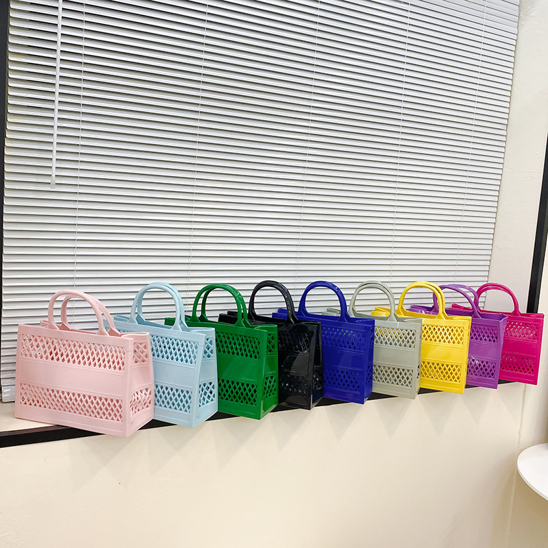 2023 Summer New Shopping Handheld Jelly Large Capacity Storage Basket Candy Color Hollow Beach Bag_voghion.com