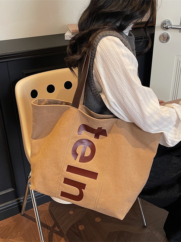 2026 nueva bolsa de hombro coreana versátil bolsa de lona casual para estudiantes universitarios de clase simple bolsa de viaje diario
