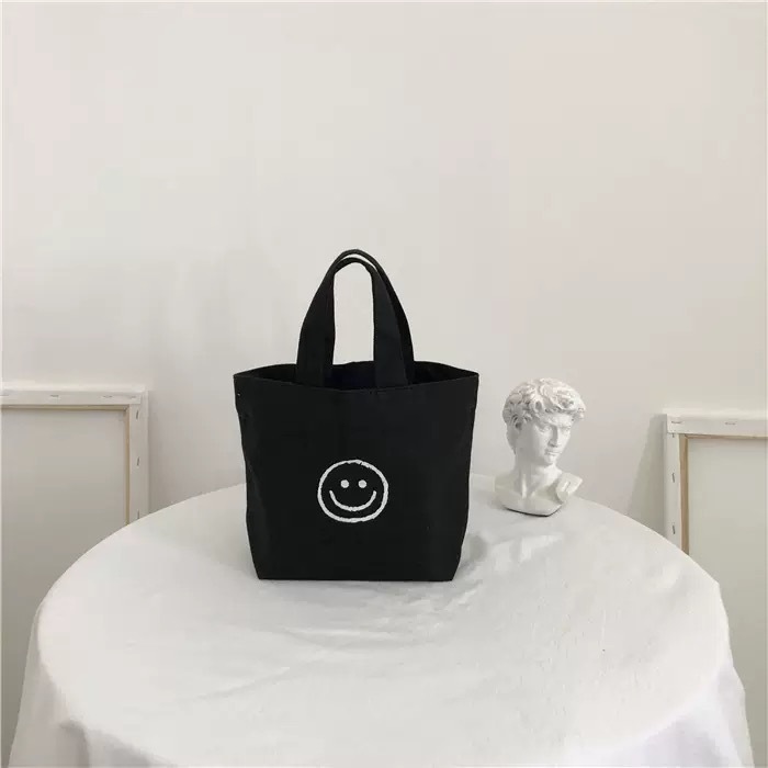 Black smiley face handbag 17*20*26