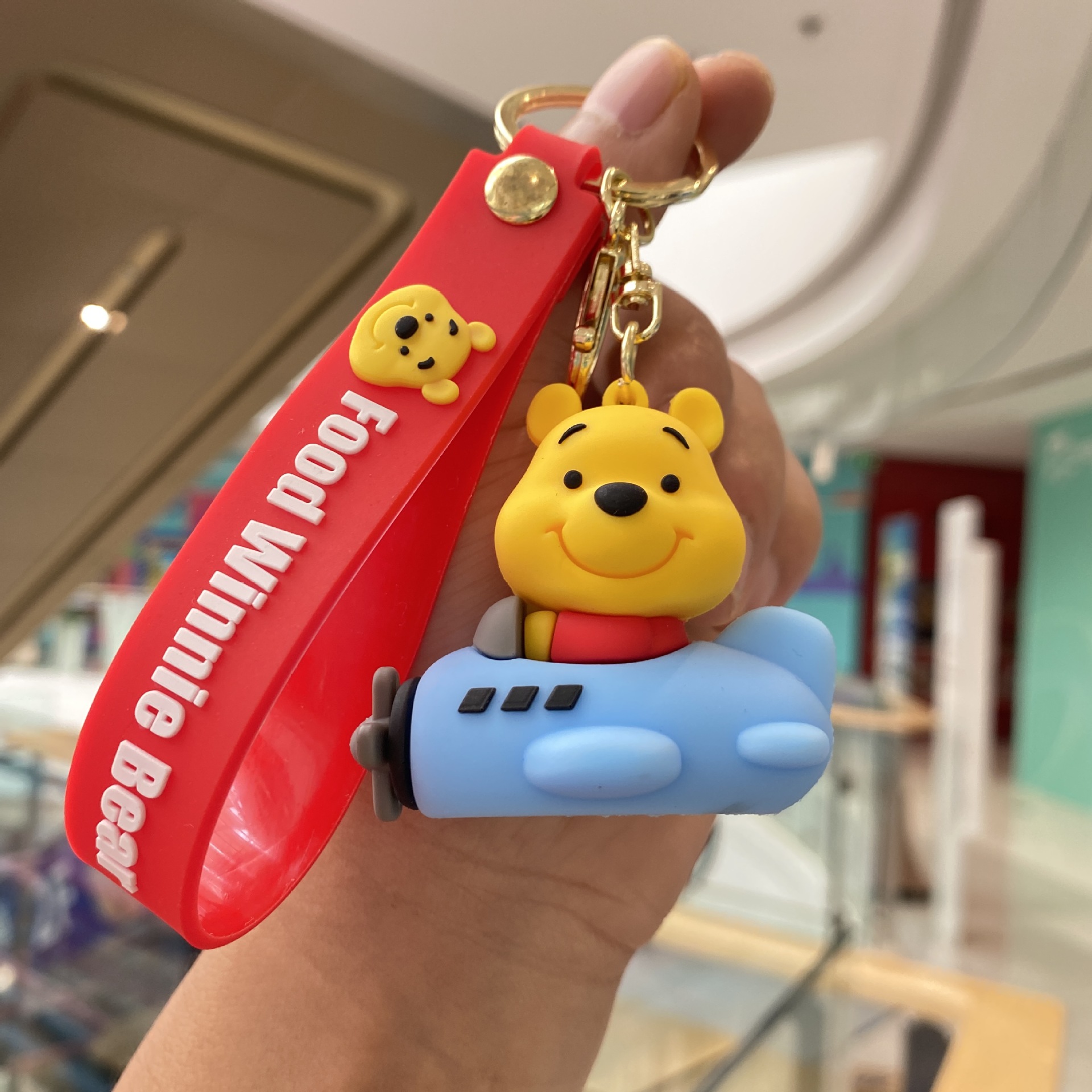 Llavero Winnie the Pooh-avión