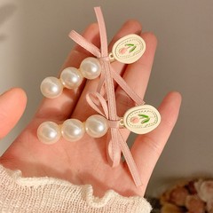 春の日は約あります。チューリップの真珠の蝶結びのヘアピンの女性の前髪のサイドクリップの超仙の花のヘアピンの飾り