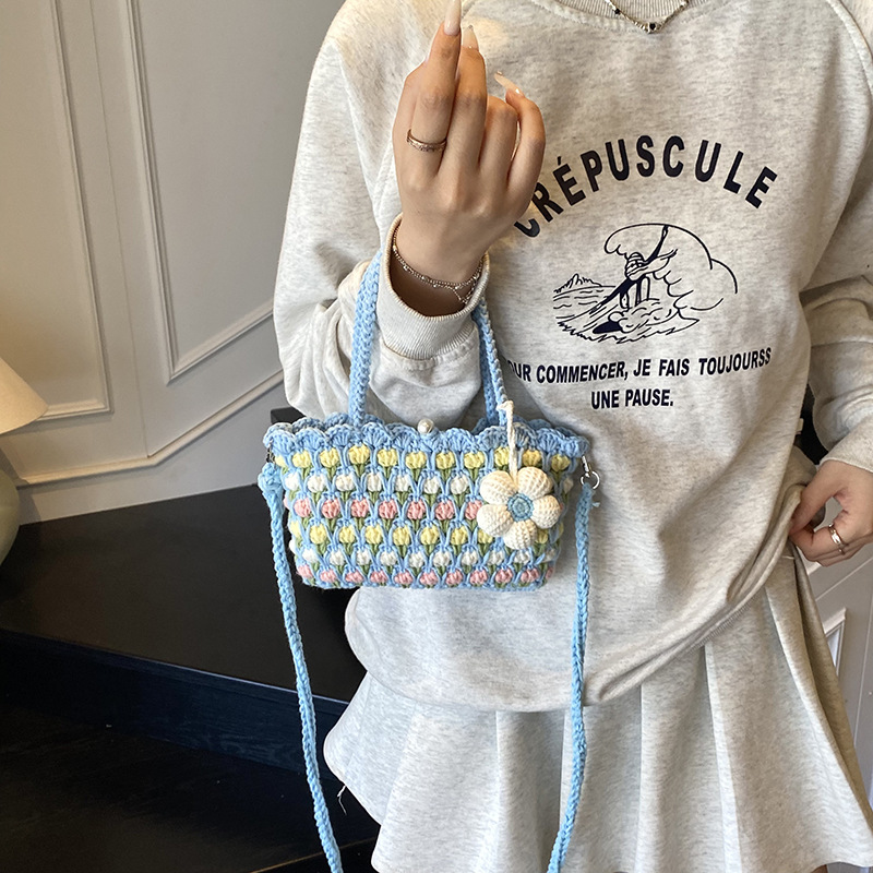 Nuevo paquete infantil transfronterizo ganchillo hecho a mano flores dulces bolsas de hombro para hombres y mujeres viajes de vacaciones bolsas de cestas de verduras portátiles