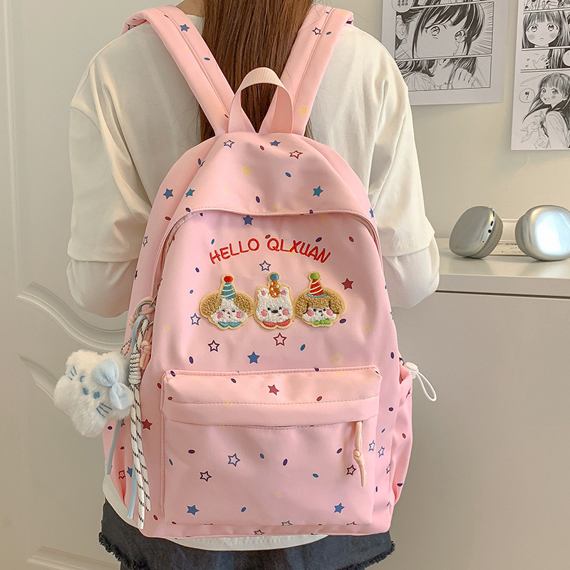 批发可爱卡通休闲双肩包新款字母小星星背包动漫小狗外出电脑背包