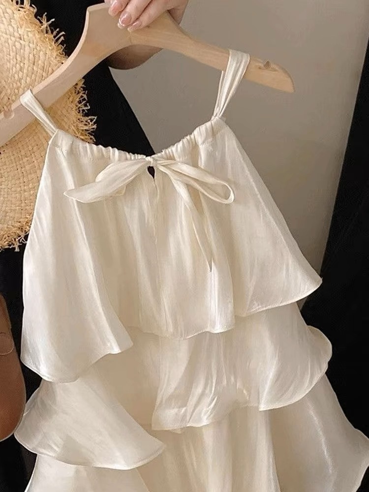 Xianning siete ropa para niños 25 verano nuevo vestido de temperamento dulce para niñas falda de tirantes de pastel con volantes de alta gama