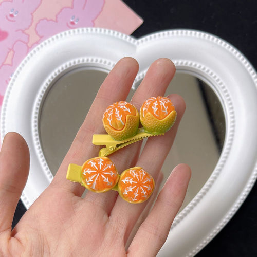 Show off a sugary mandarin orange hair clip—adorable little orange BB clips with a girly, food-inspired design, perfect as seaside accessories or cartoon-themed headwear!
