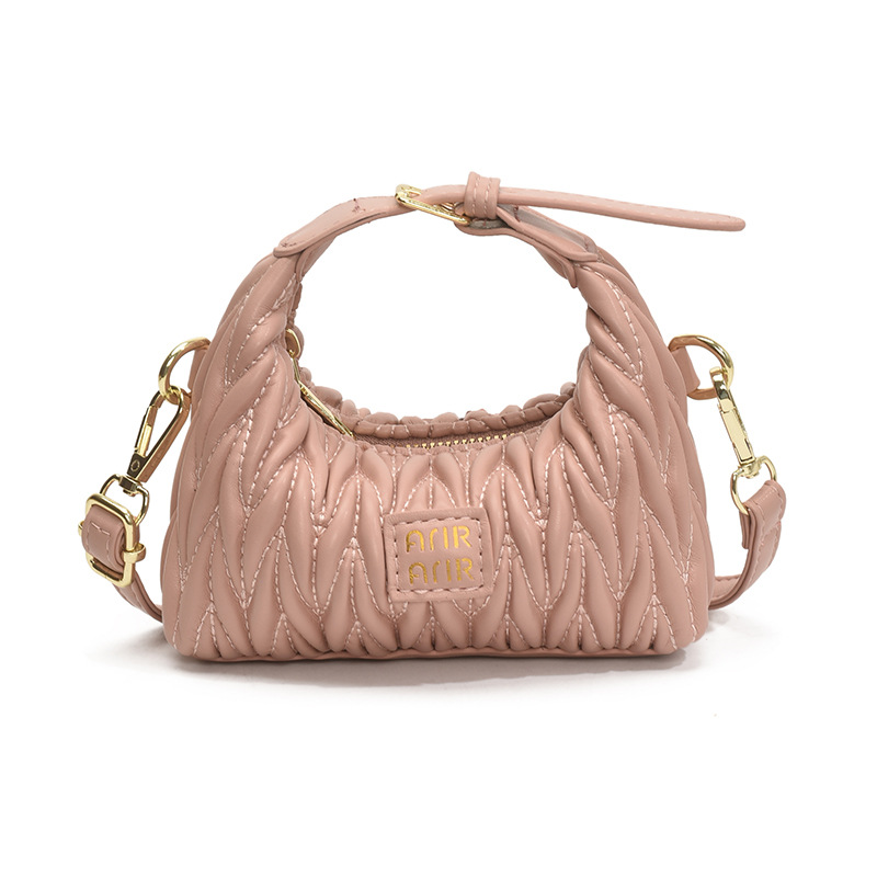 Bolsa de hombro de chicas plegadas de moda simple color sólido mini bolso de bebé 2025 nuevo bolso infantil transfronterizo