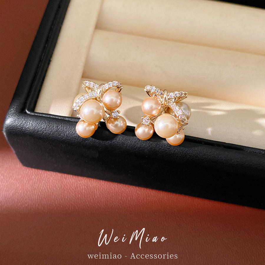 Agujas de plata mariposa gota de piedra aretes de perlas ligeros de lujo de alta calidad pernos diarios temperamento al por mayor auriculares