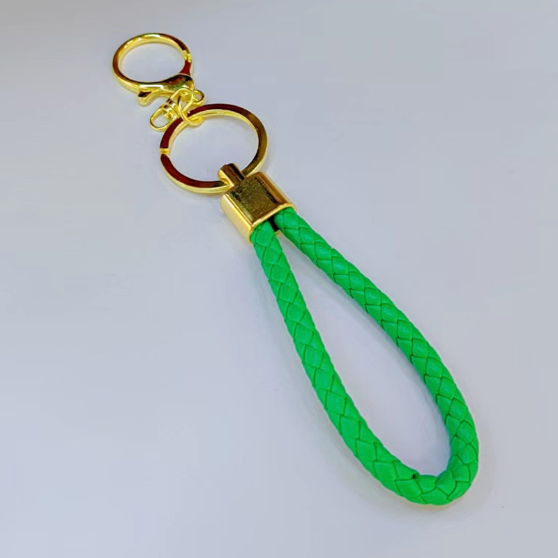 Ronda de la langosta hebilla PU cuero trenzado cuerda llavero hombres y mujeres amor llavero mano cuerda bolsa cordón fábrica directa al por mayor